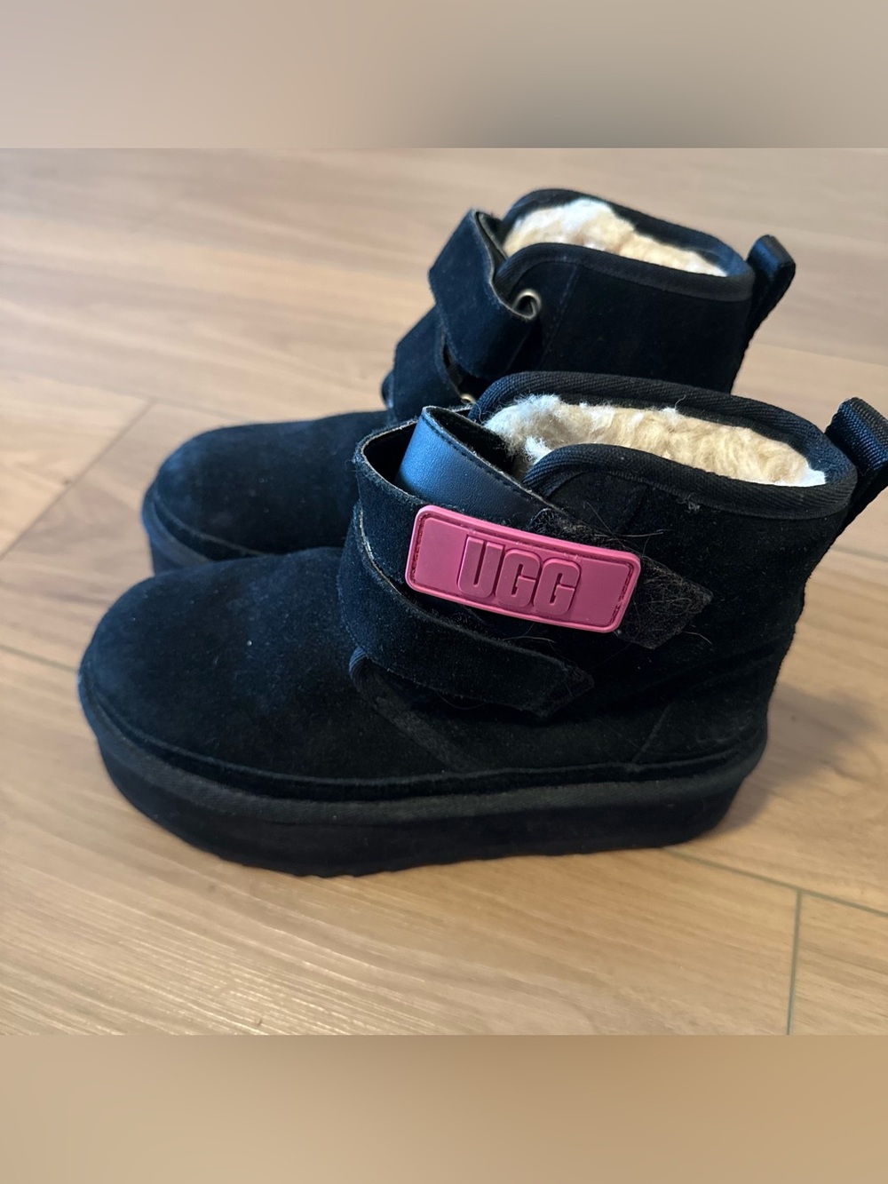 UGG that was Black Suede Ankle Boots with Pink Logo Strap